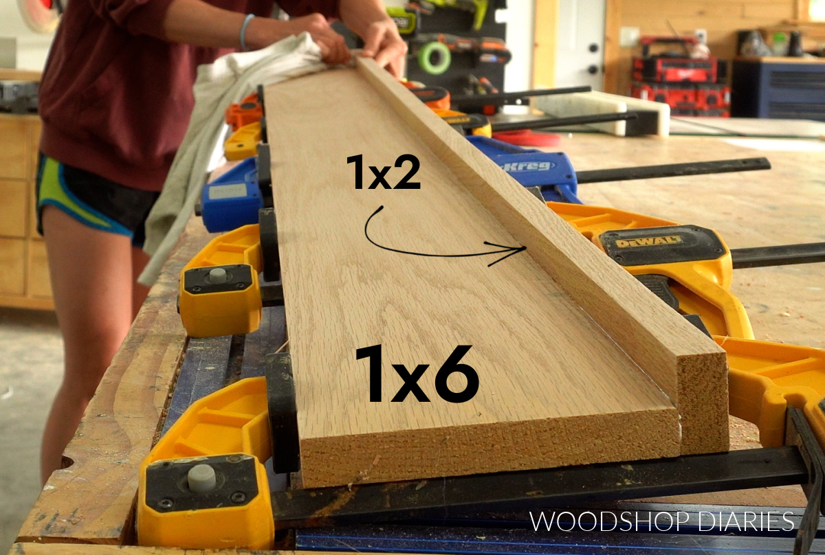 red oak 1x2 and 1x6 glued up in clamps on workbench