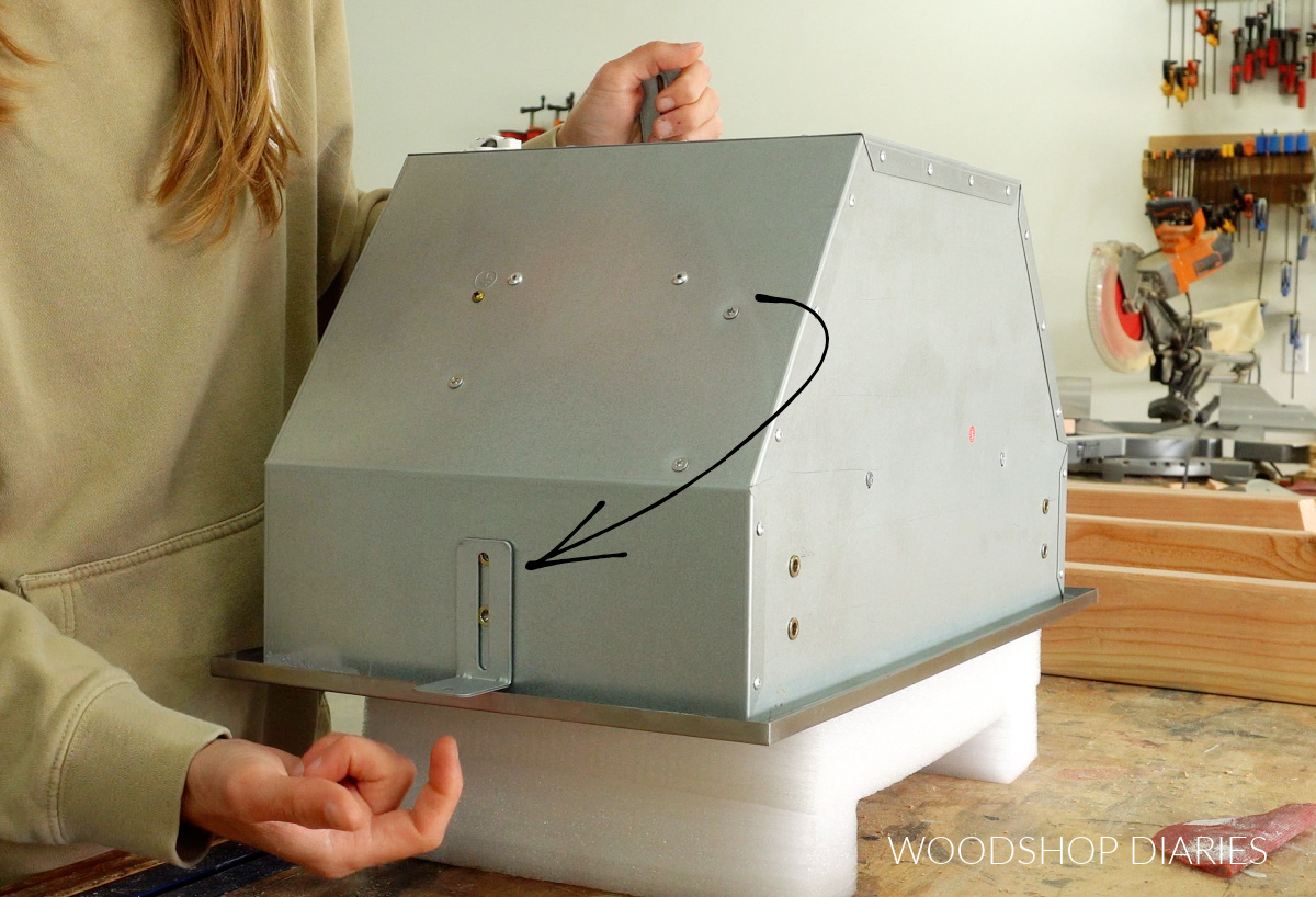 Close up of fan insert showing L brackets on the sides for mounting