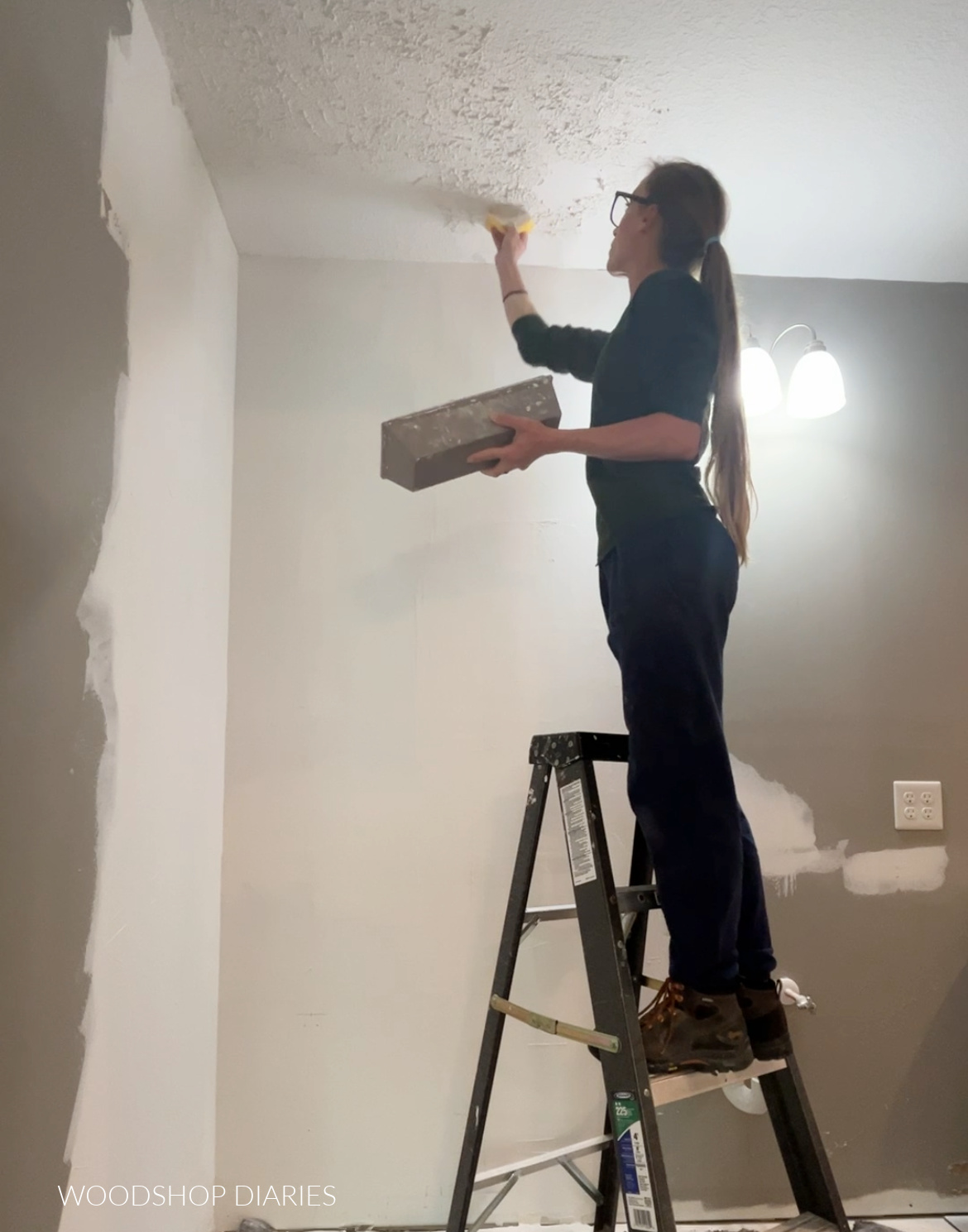 Shara Woodshop Diaries sponging knockdown texture onto ceiling