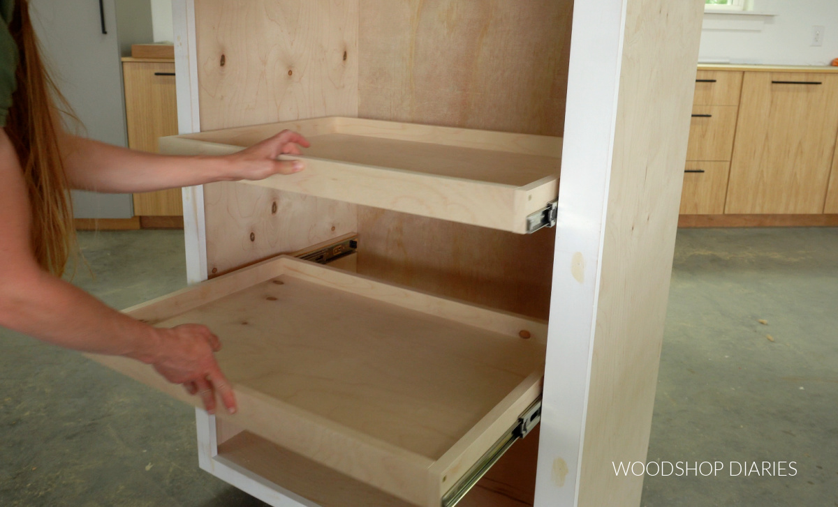 Pull out pantry shelves installed into cabinet on side mount slides