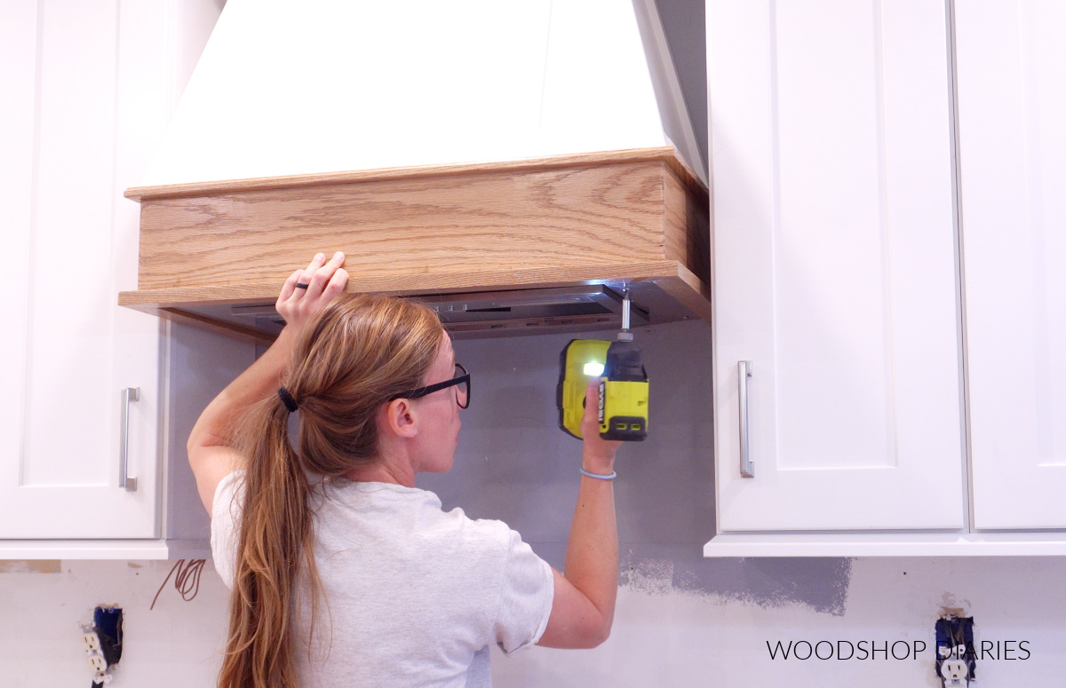 securing ran insert into range hood cover with screws through the bottom
