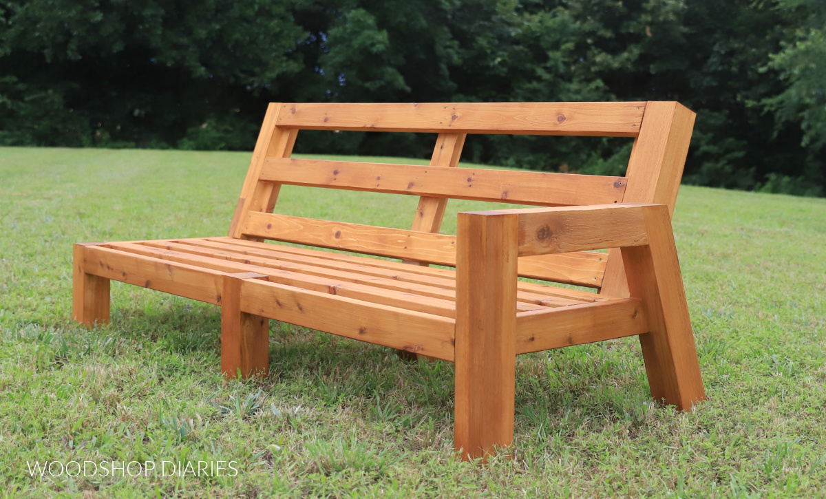 3 seater sectional sofa piece by itself in grass without cushions