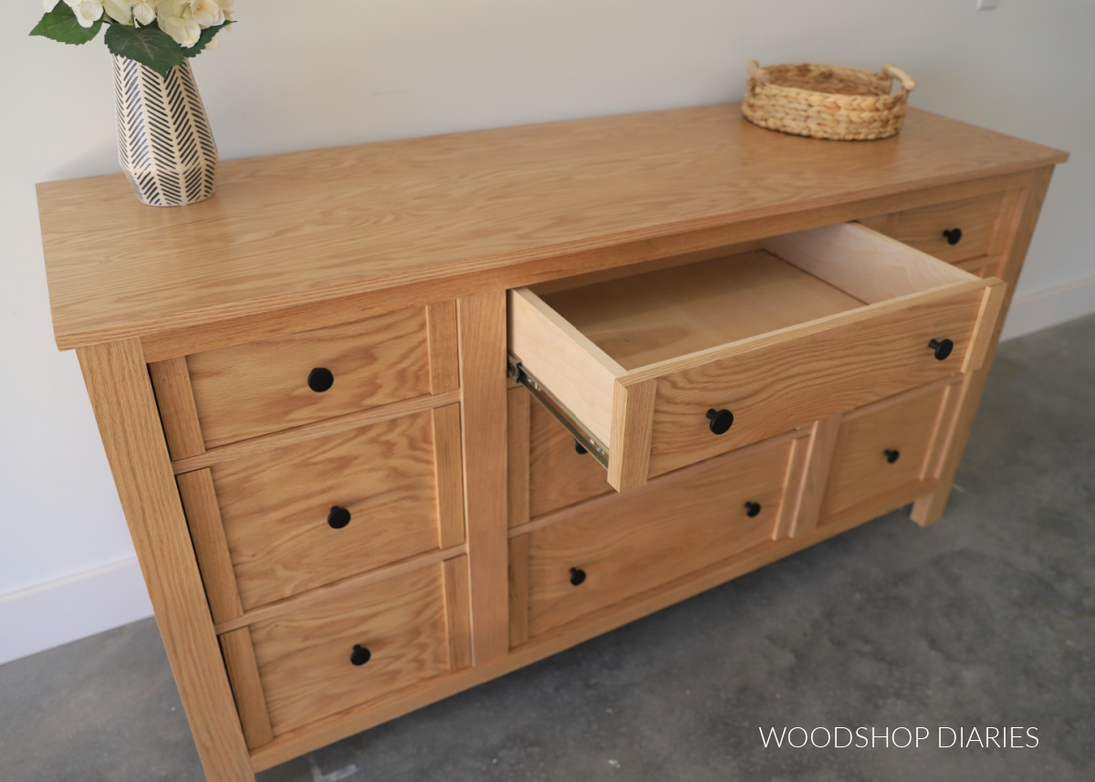 Completed DIY 9 drawer dresser with top center drawer open