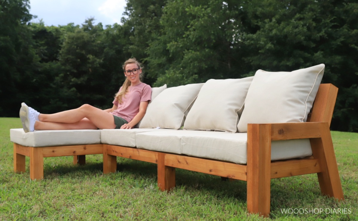 Shara Woodshop Diaries sitting on chaise sectional with cushions