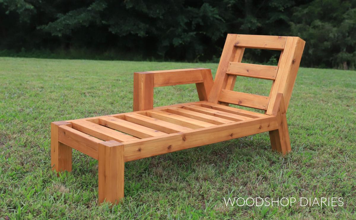 Chaise lounge sectional piece by itself in grass without cushions