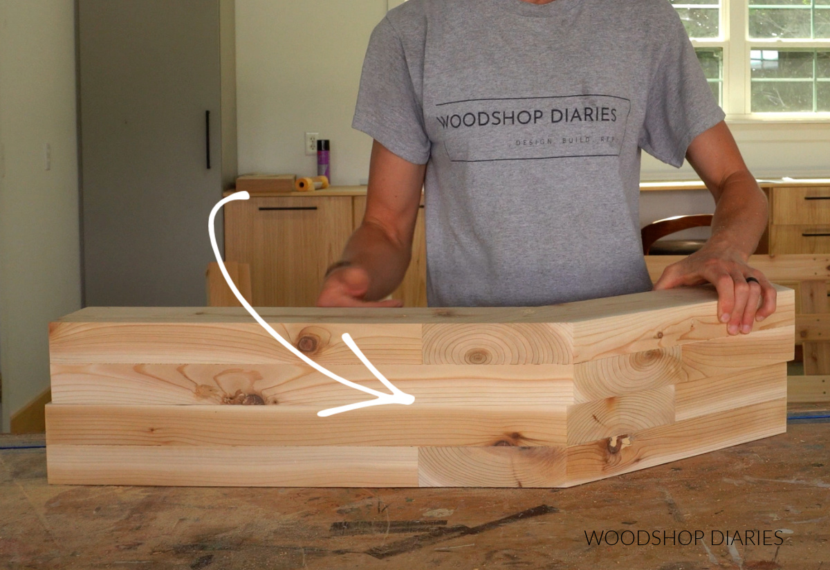 Angled back supports for sectional frame on workbench showing mirrored orientation