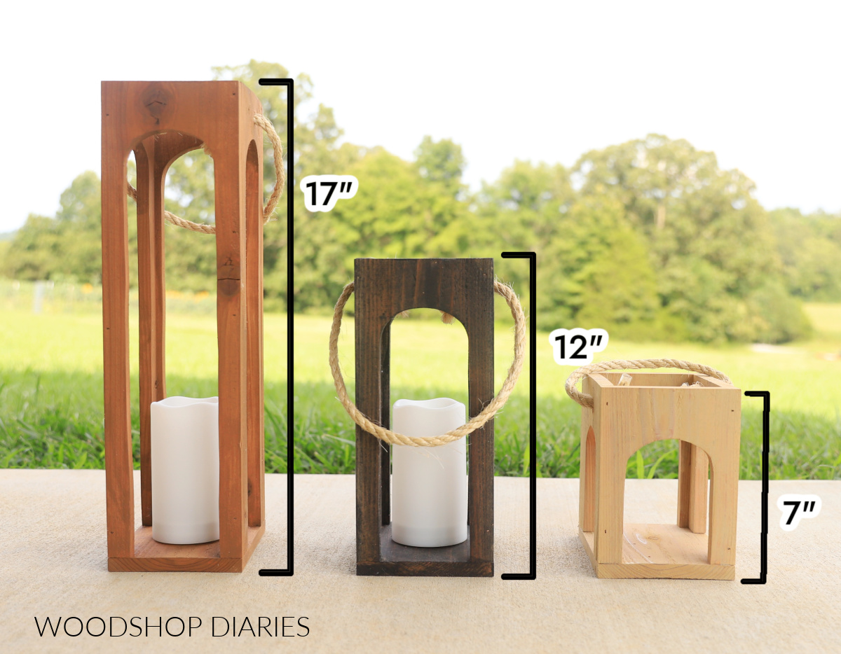 Three scrap wood arched lanterns finished sitting next to each other with height dimension next to each one