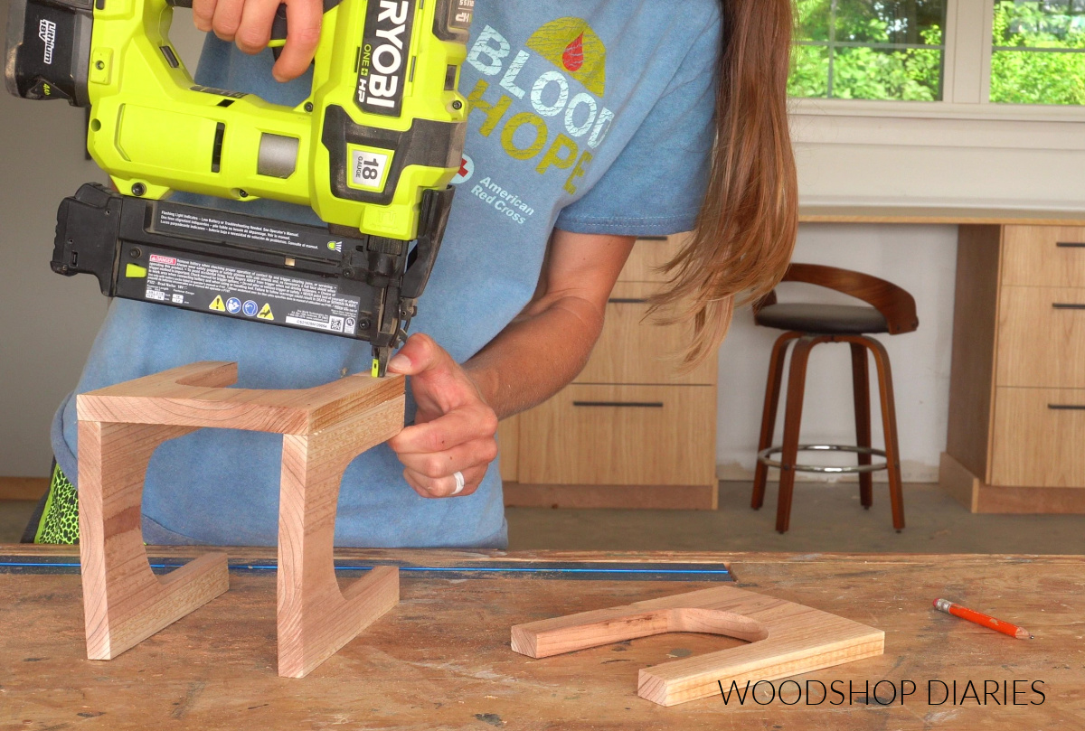 Shara Woodshop Diaries nailing arched lantern sides together on workbench