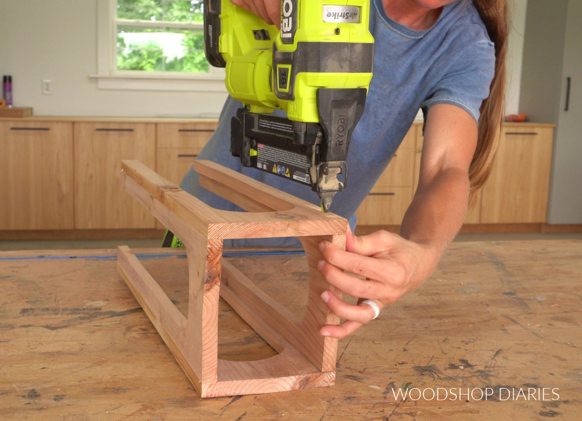 Shara Woodshop Diaries nailing arched sides of lantern together on workbench