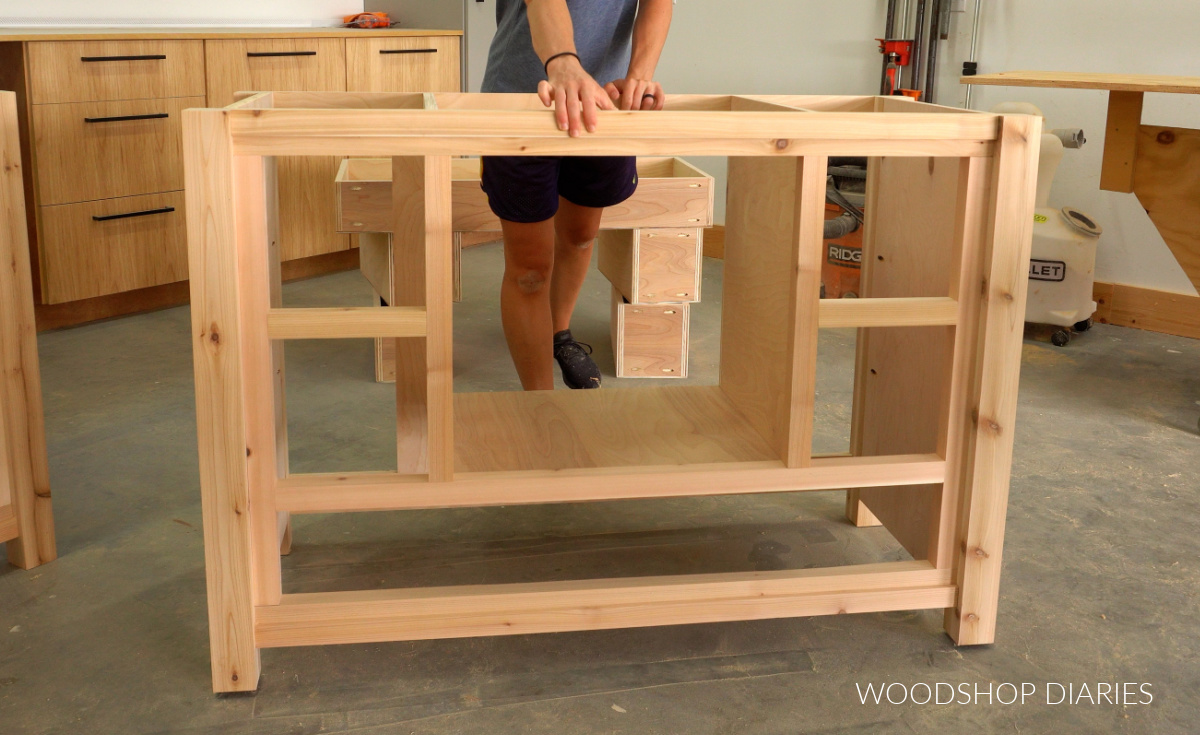 Completed DIY single sink bathroom vanity cabinet with divider and bottom panels installed