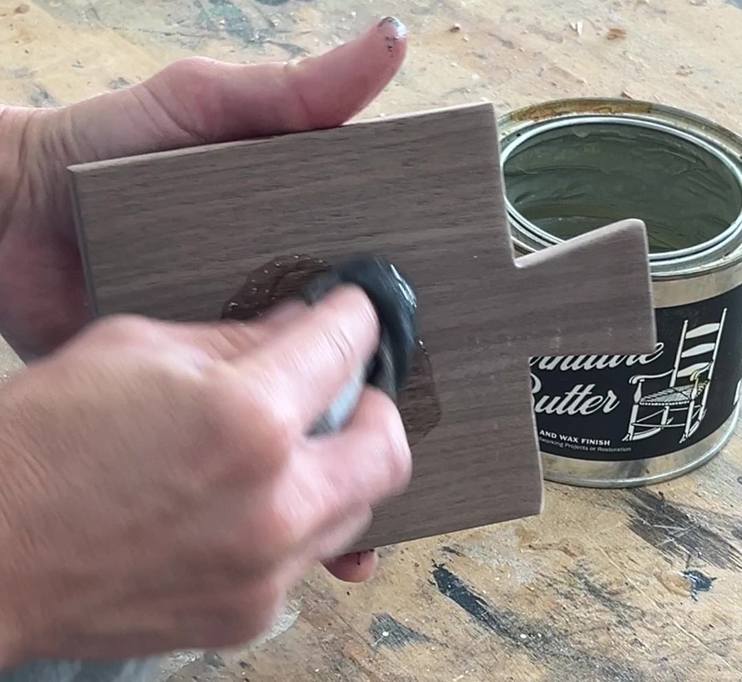 Applying furniture butter to drink coaster