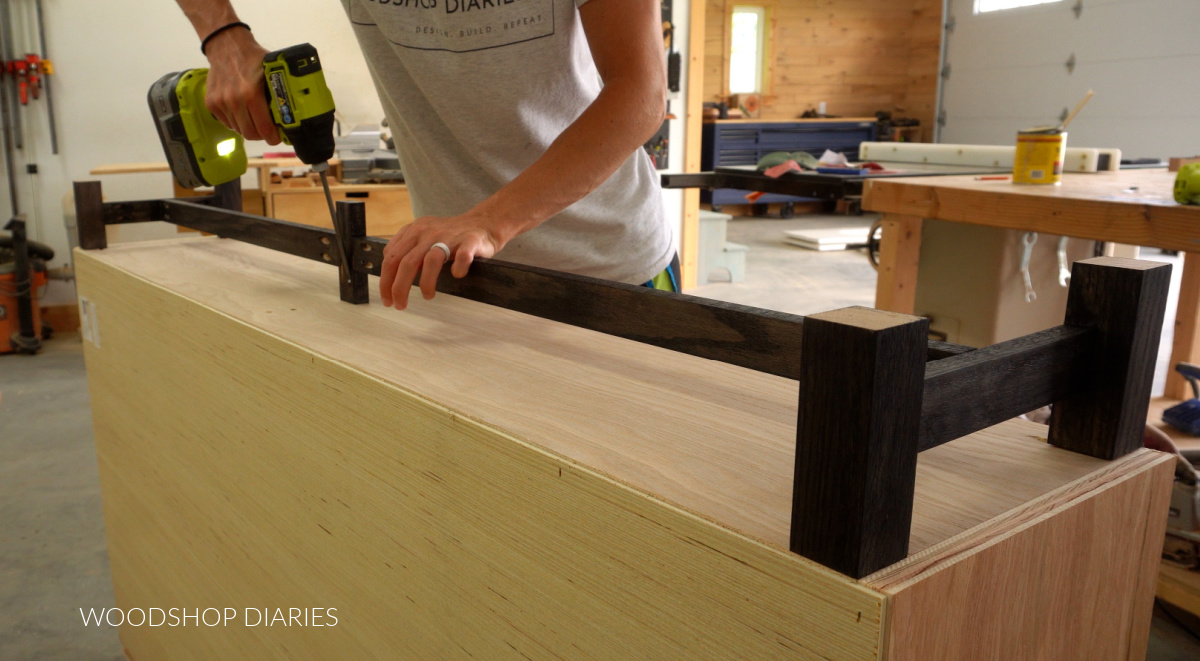 Installing base to bottom of console cabinet with pocket hole screws