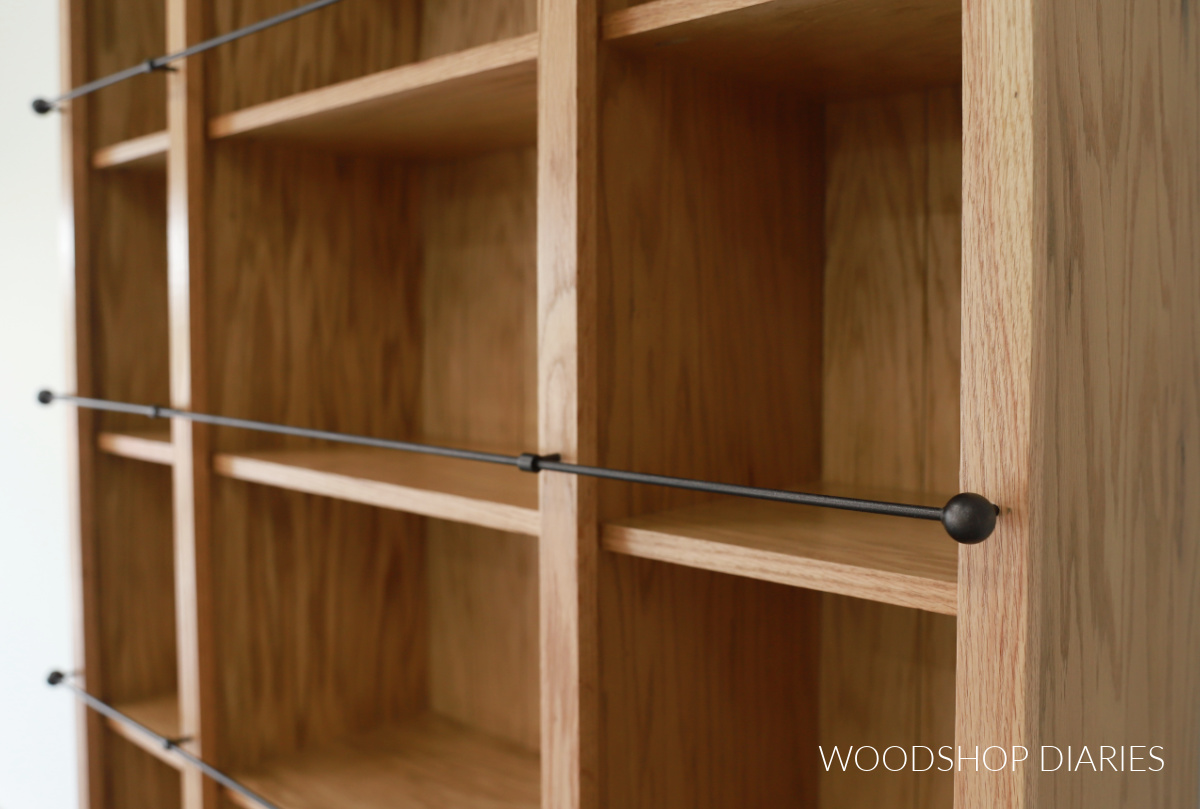 Close up of faux DIY gallery railing on the front of bookcase