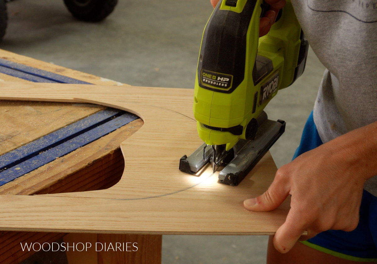 Close up of jig saw cutting around arch in plywood panel