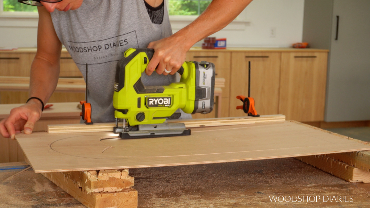 Shara Woodshop Diaries using a jig saw to cut out inside of cabinet door with straight edge 