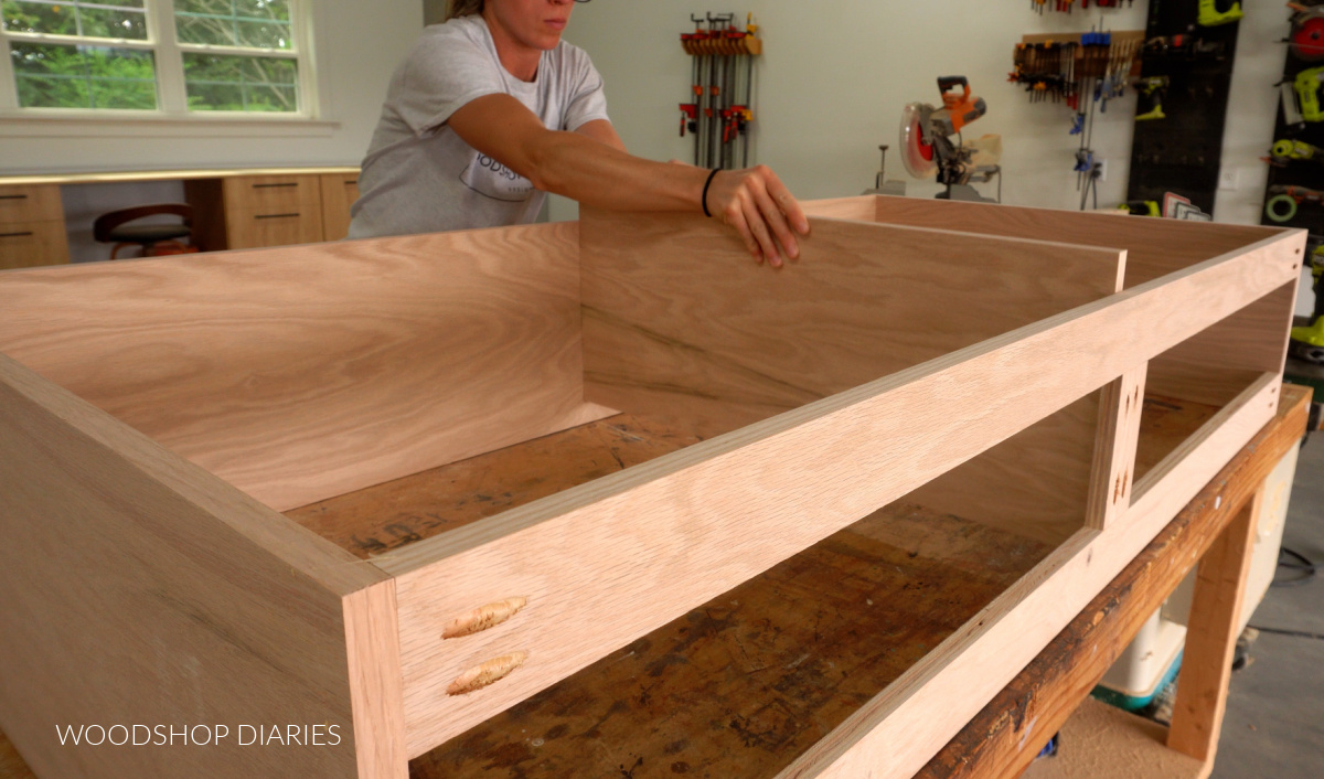 Placing middle divider inside sideboard console cabinet project on workbench