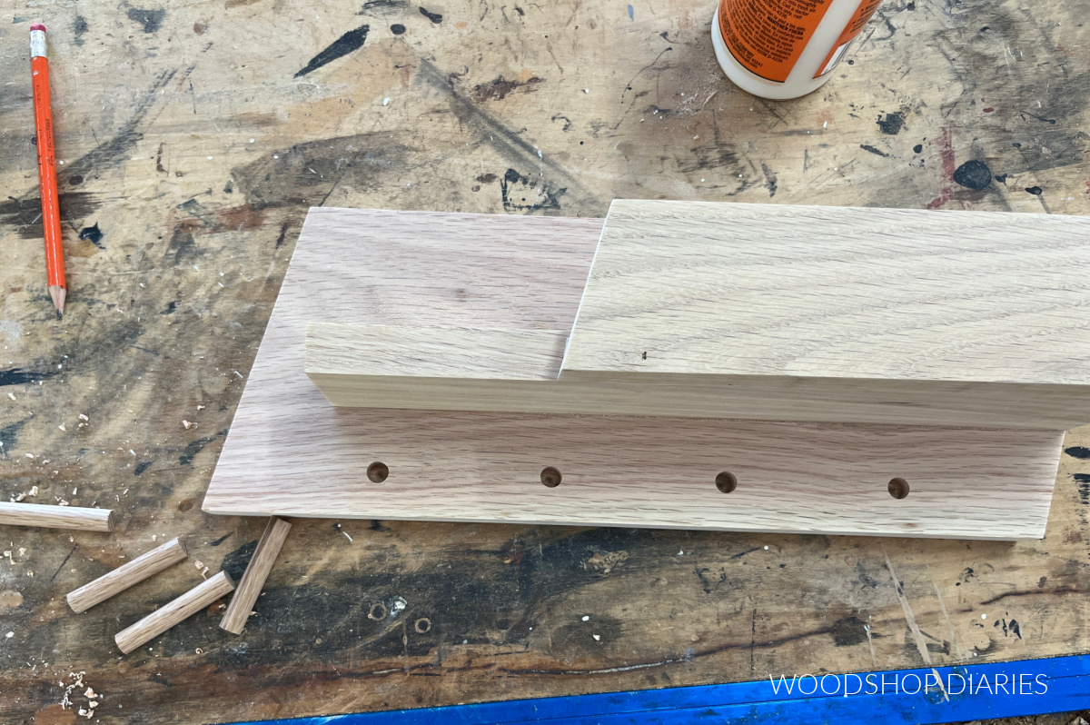 Holes drilled in wall organizer for wooden key pegs