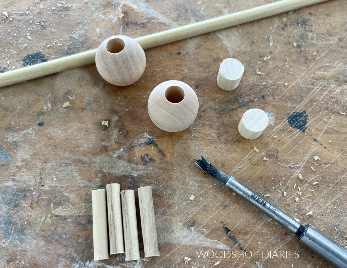 wooden balls and dowels--pieces needed to create DIY gallery shelf rail