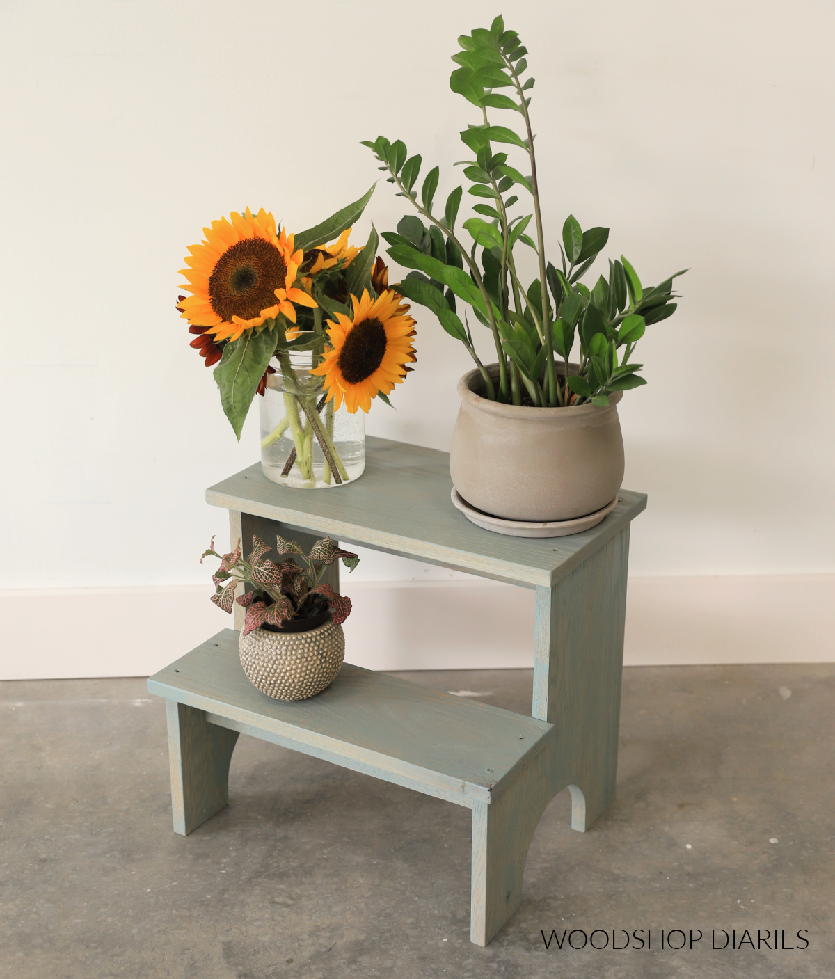 Two tiered DIY plant stand side table shaped like step stool