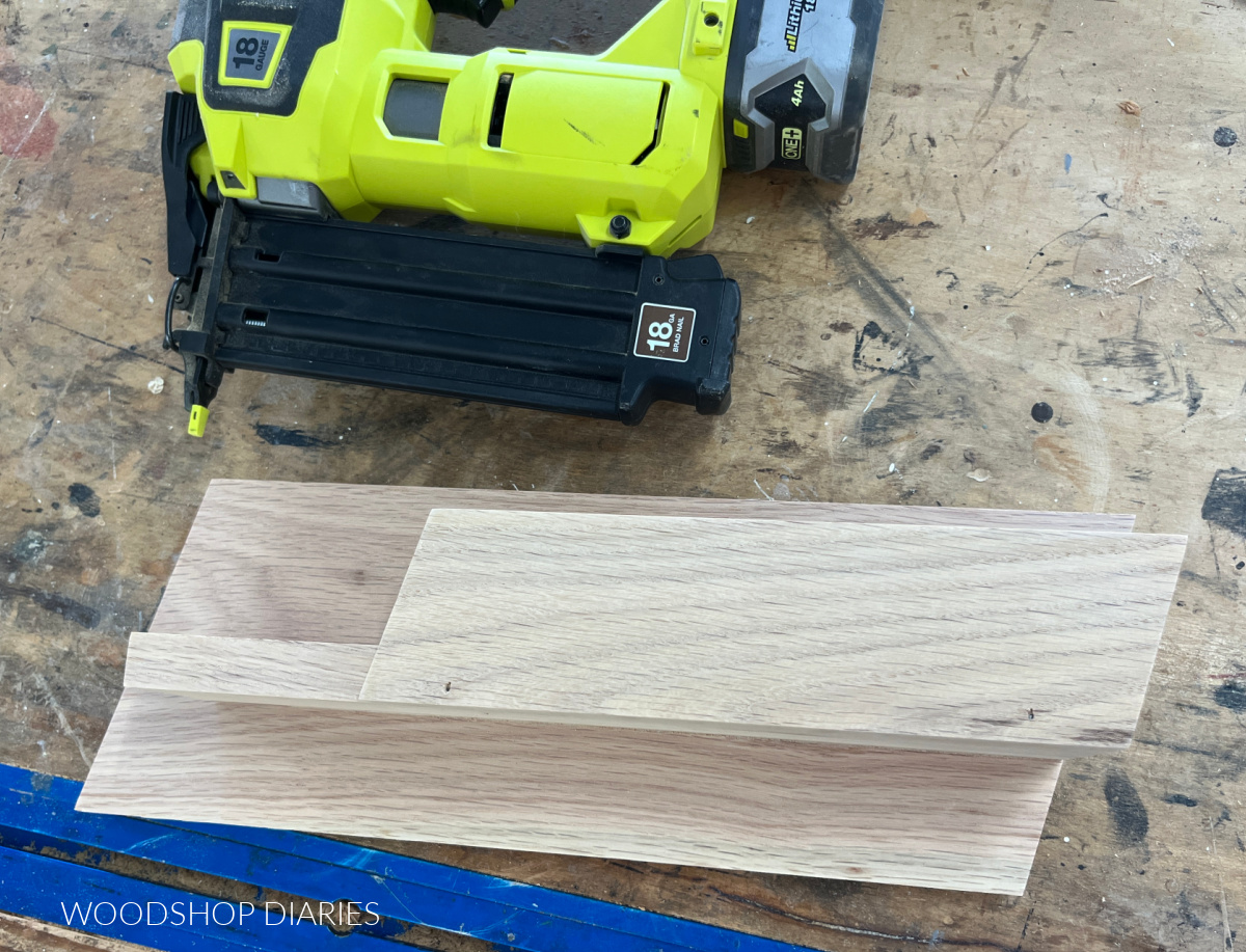 Key holder wall organizer shelf assembled on workbench next to brad nailer