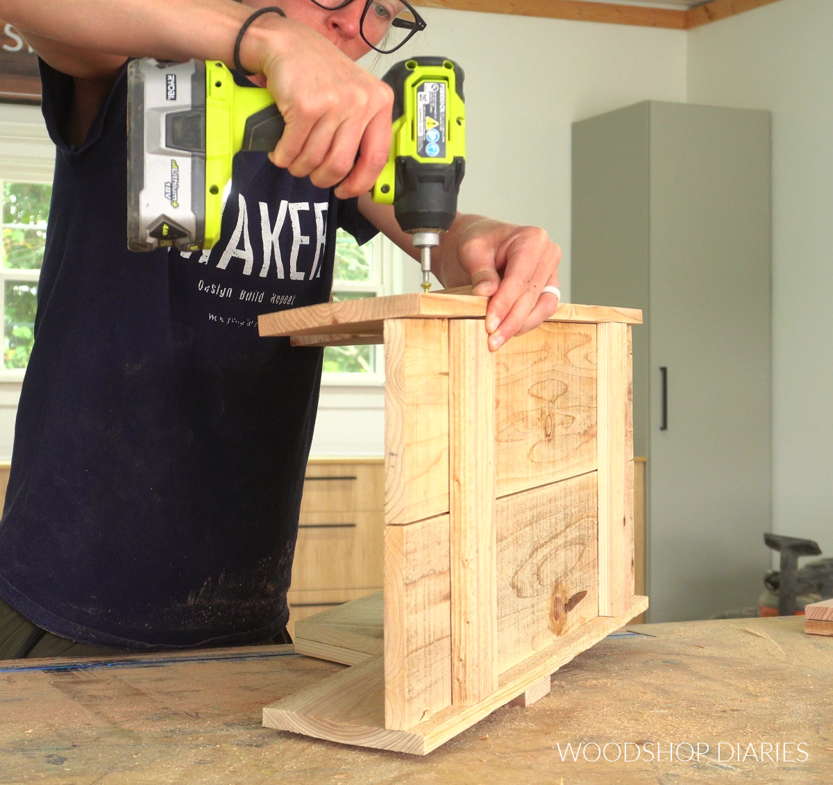 Shara Woodshop Diaries assembling wooden wheelbarrow body with screws