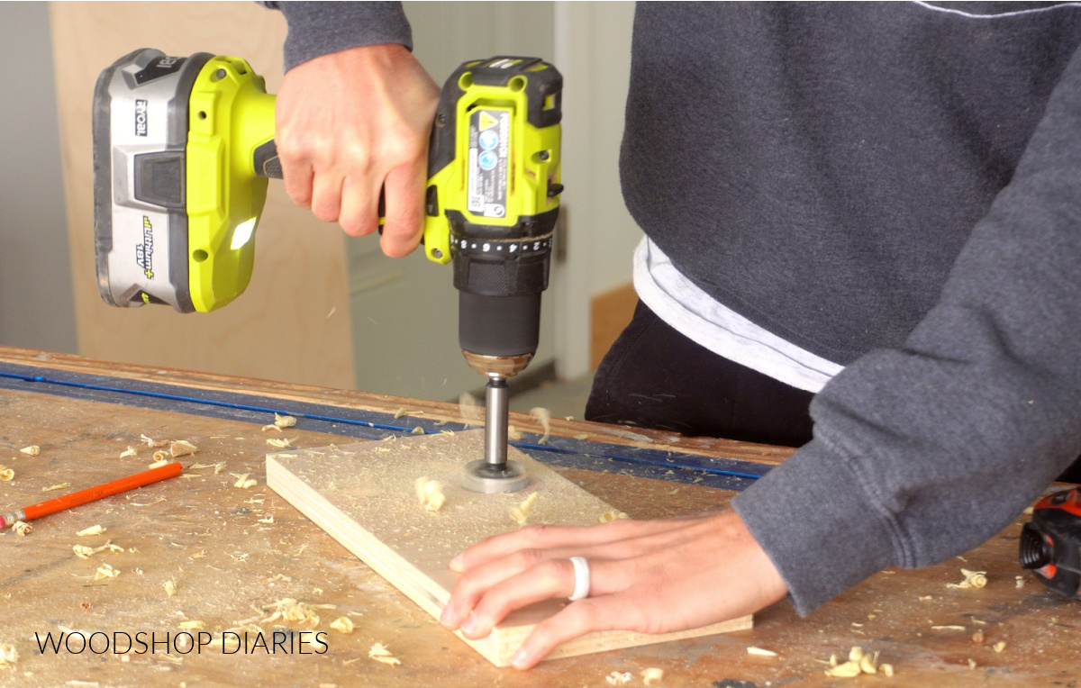 Drilling hole in plywood piece with Forstner bit to install hanging rod