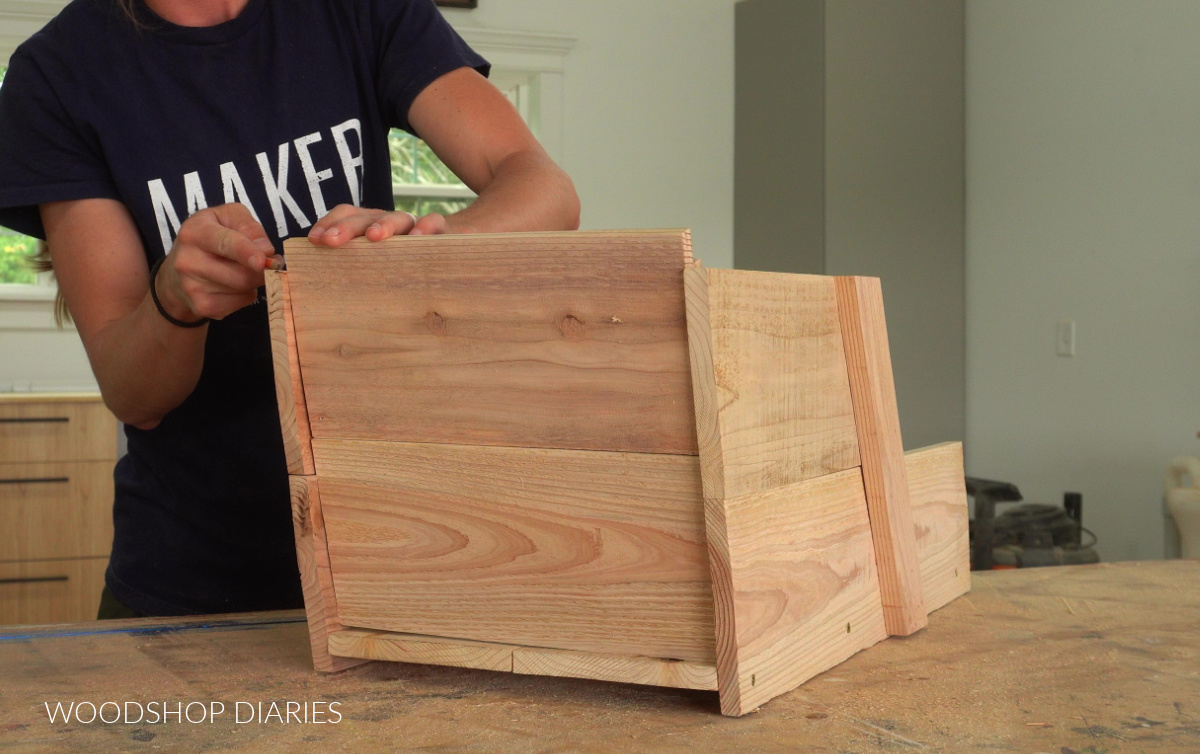 Shara Woodshop Diaries test fitting pieces of DIY decorative wheelbarrow