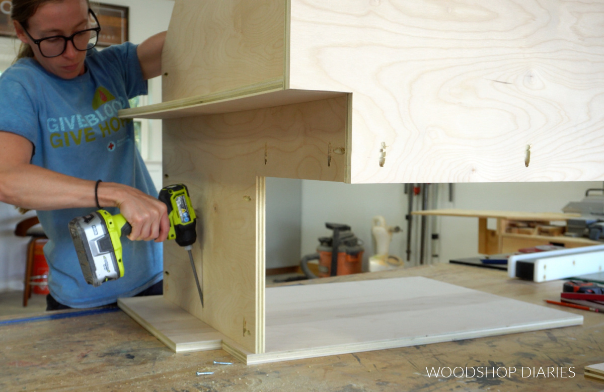 Shara Woodshop Diaries assembling corner base cabinet with pocket hole screws on workbench