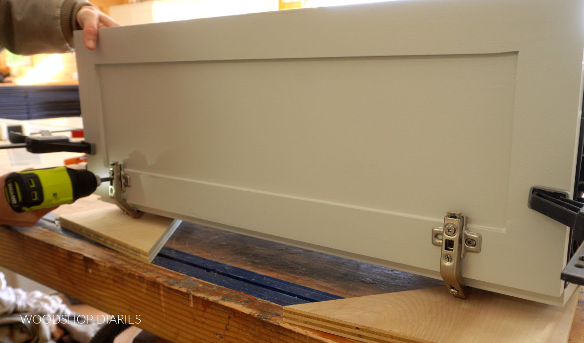 Attaching bi fold cabinet doors together with 135 degree hinges