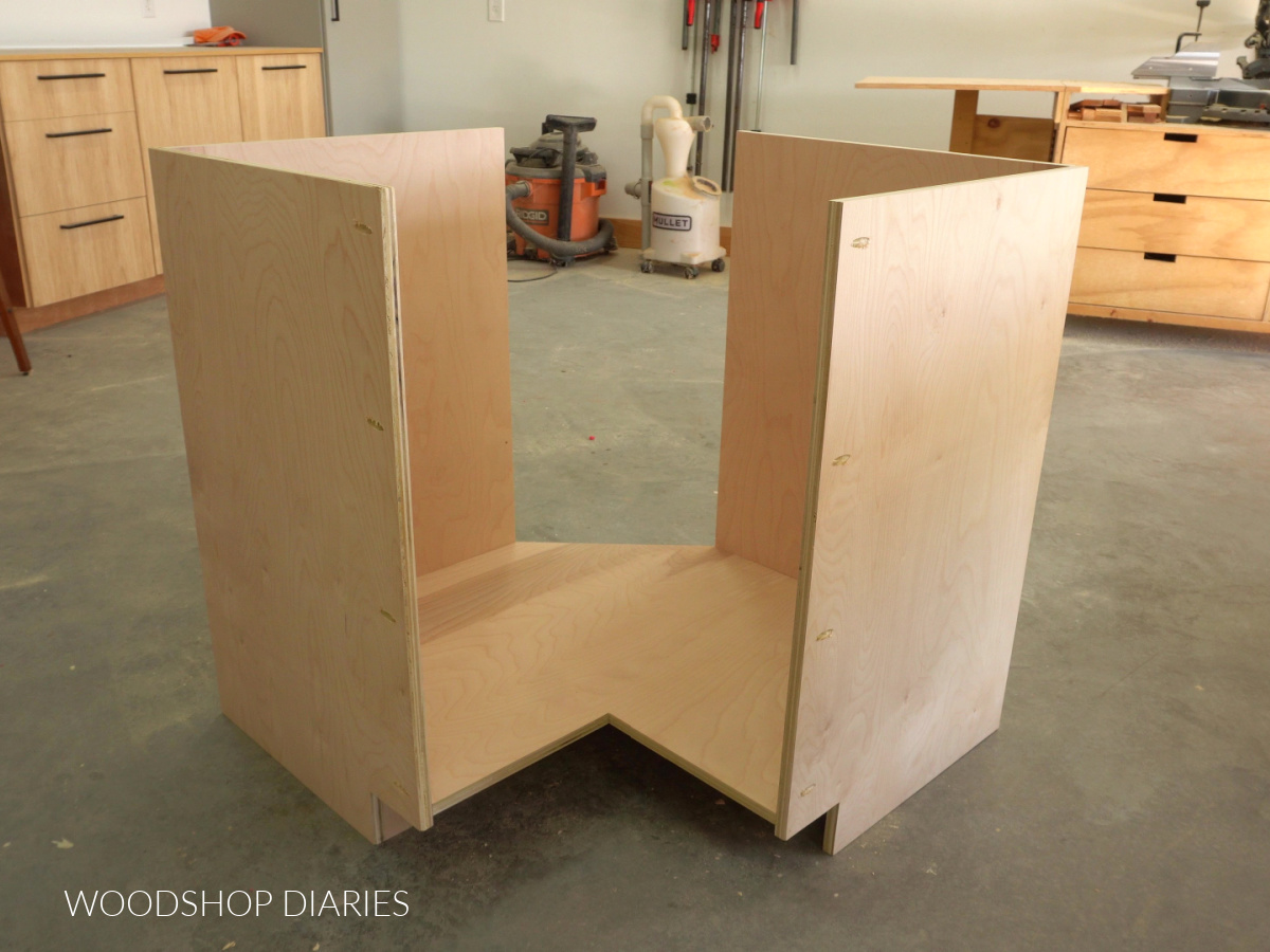 Corner cabinet carcass partially assembled in workshop