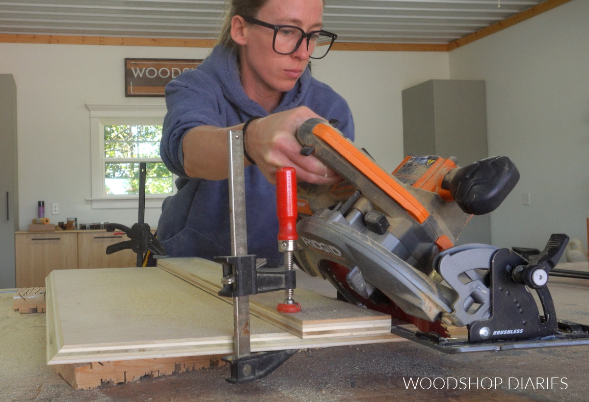 Shara Woodshop Diaries cutting beveled edges on back panel of corner cabinet with circular saw
