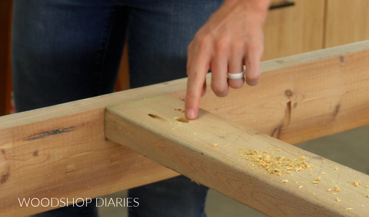 Slot hole drilled out in dining table support to attach table top