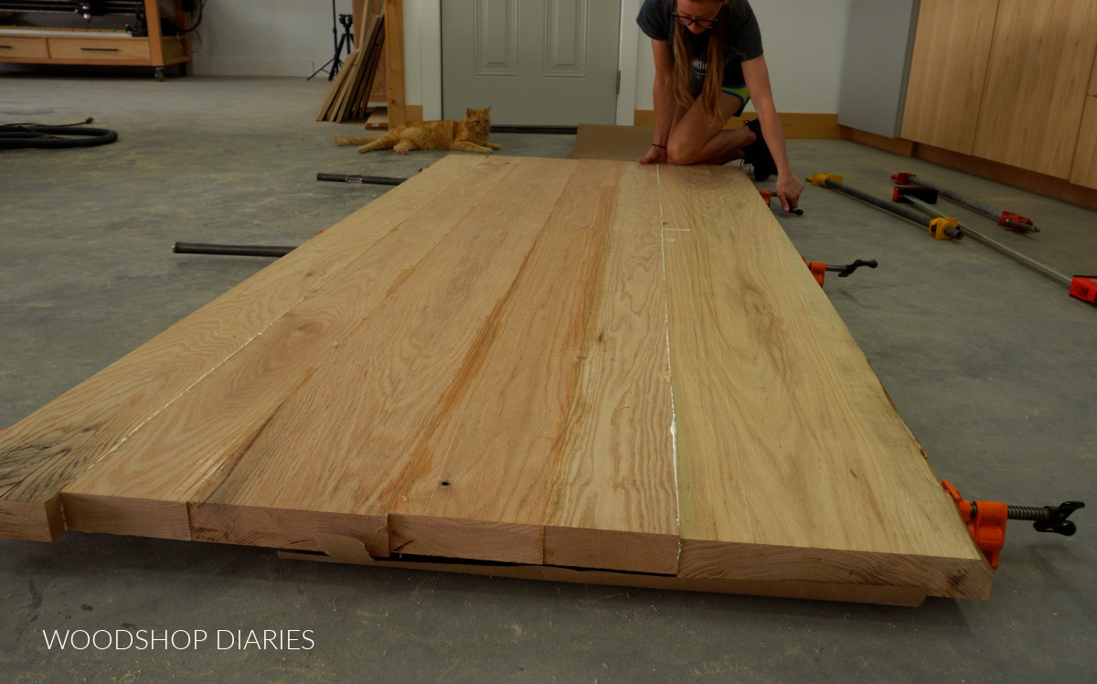 Shara Woodshop Diaries gluing up large dining table top on workshop floor