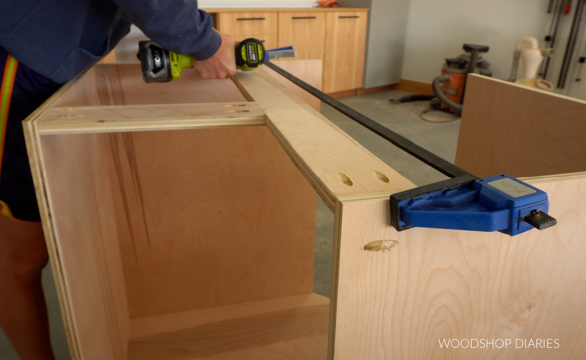 Shara Woodshop Diaries assembling cabinet box with pocket holes using large clamp