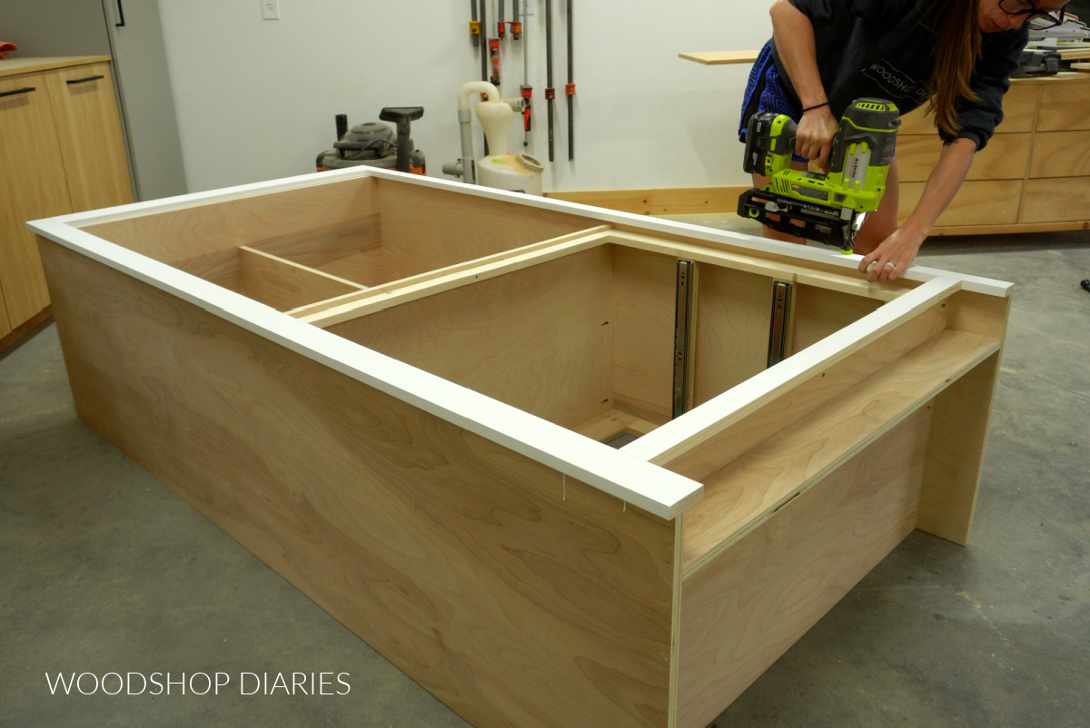 Shara Woodshop Diaries nailing face frame onto front of larder cupboard