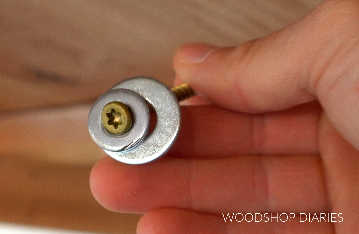 Wood screw with two different size washers
