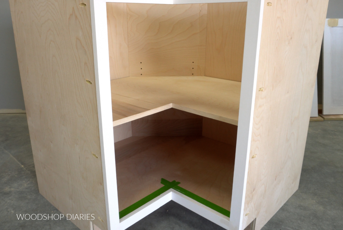 Adjustable shelf installed into corner base cabinet