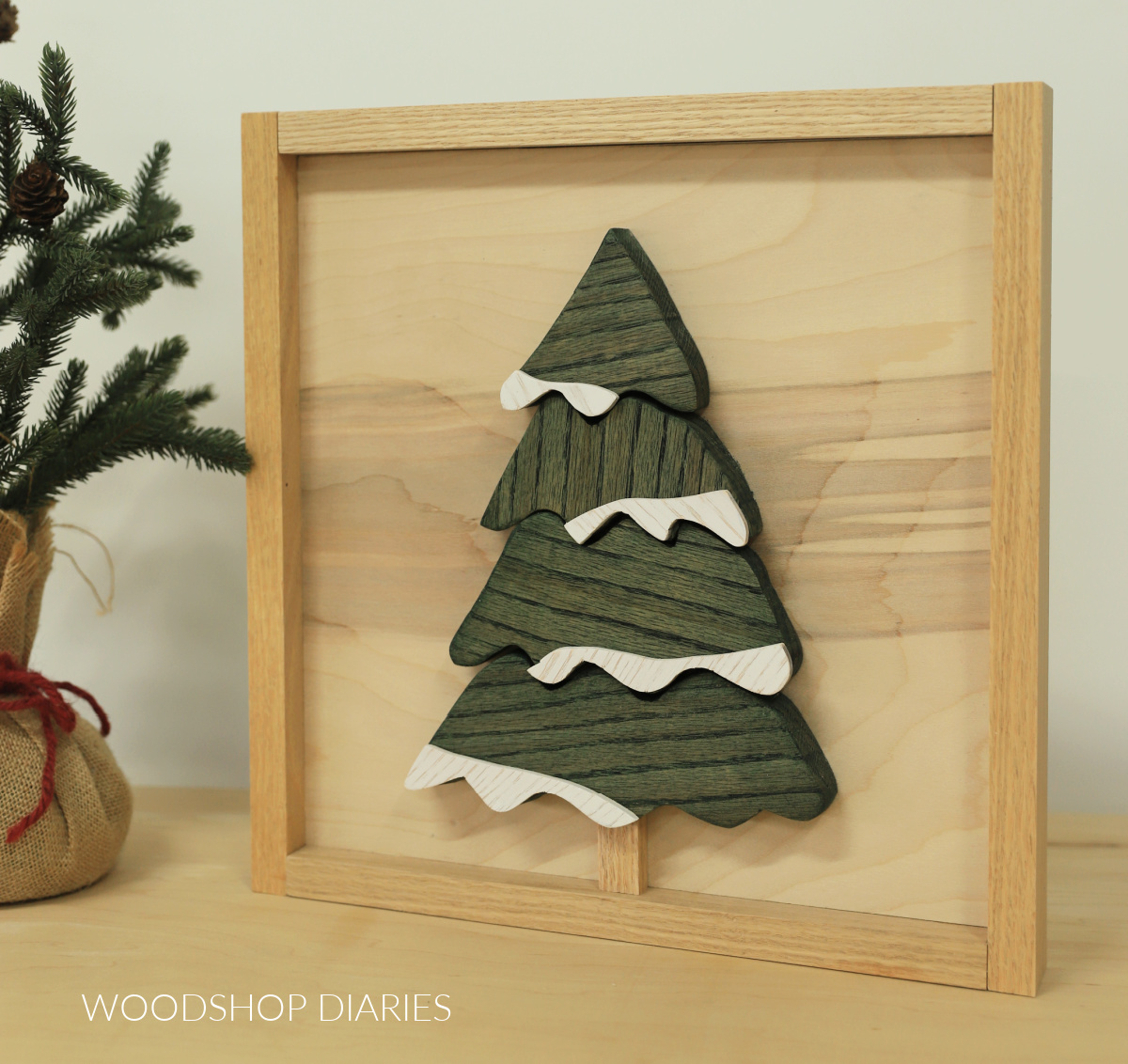 Completed scrap wood Christmas tree wood art sign standing on work surface