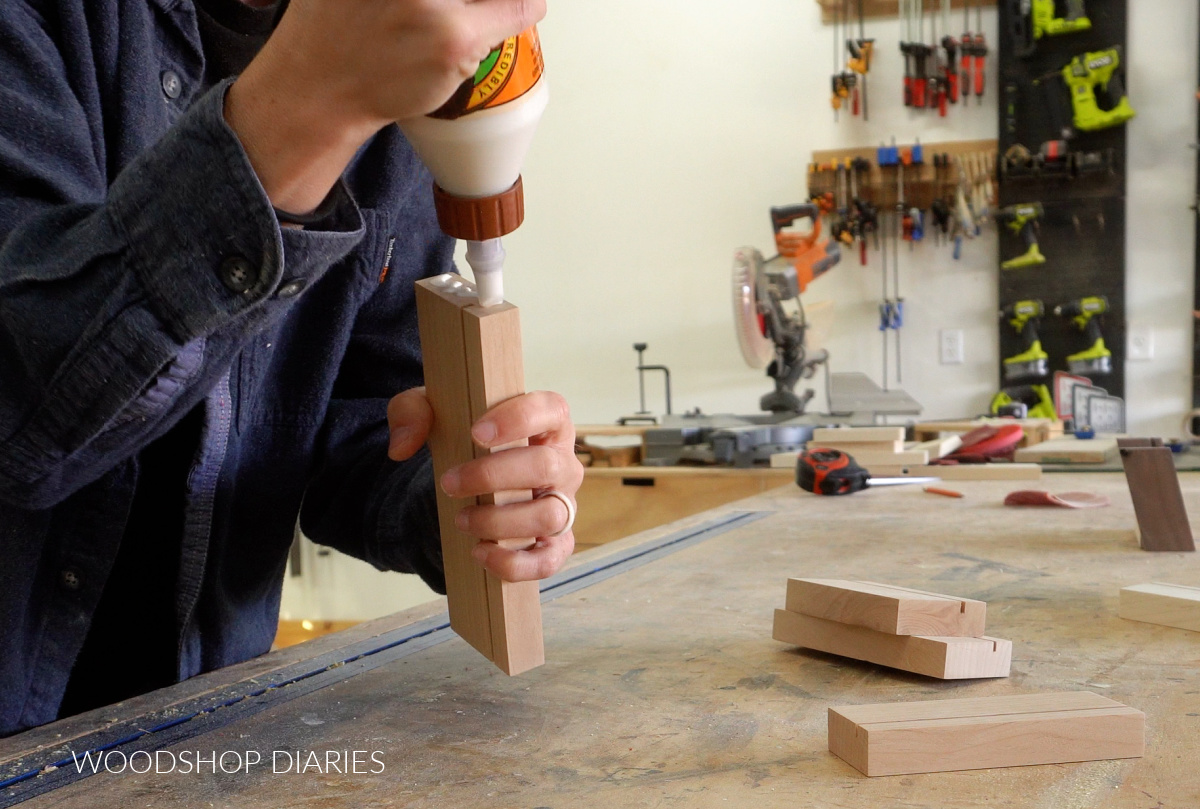 Shara Woodshop Diaries applying wood glue to end of bottom piece of photo frame