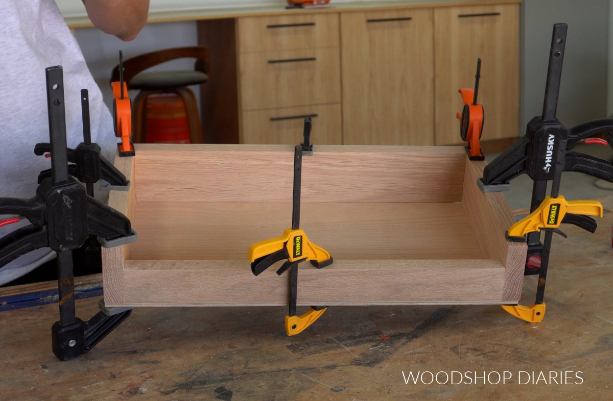 Game board storage box/stand assembled on workbench in clamps
