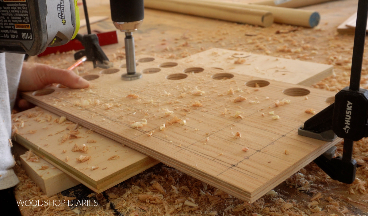Shara Woodshop Diaries drilling holes for 4 in a row wood game