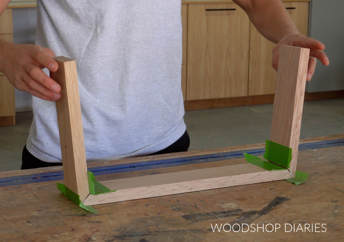 Shara Woodshop Diaries gluing up mitered corners on connect 4 storage box