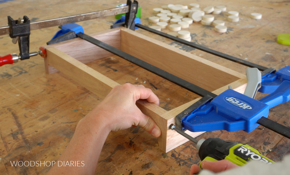 Driving a screw to attach 1x2 to front of storage box