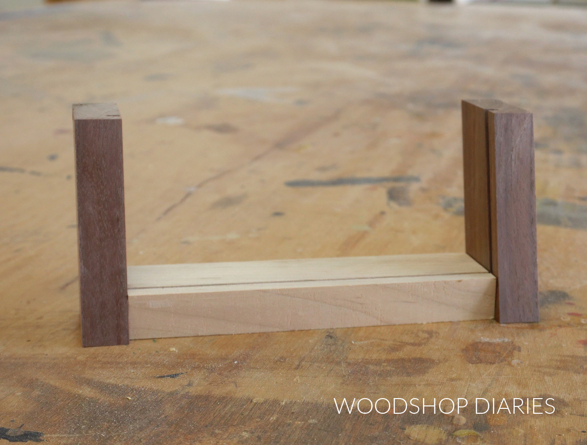 Maple and walnut landscape photo frame pieces cut and dry fit together
