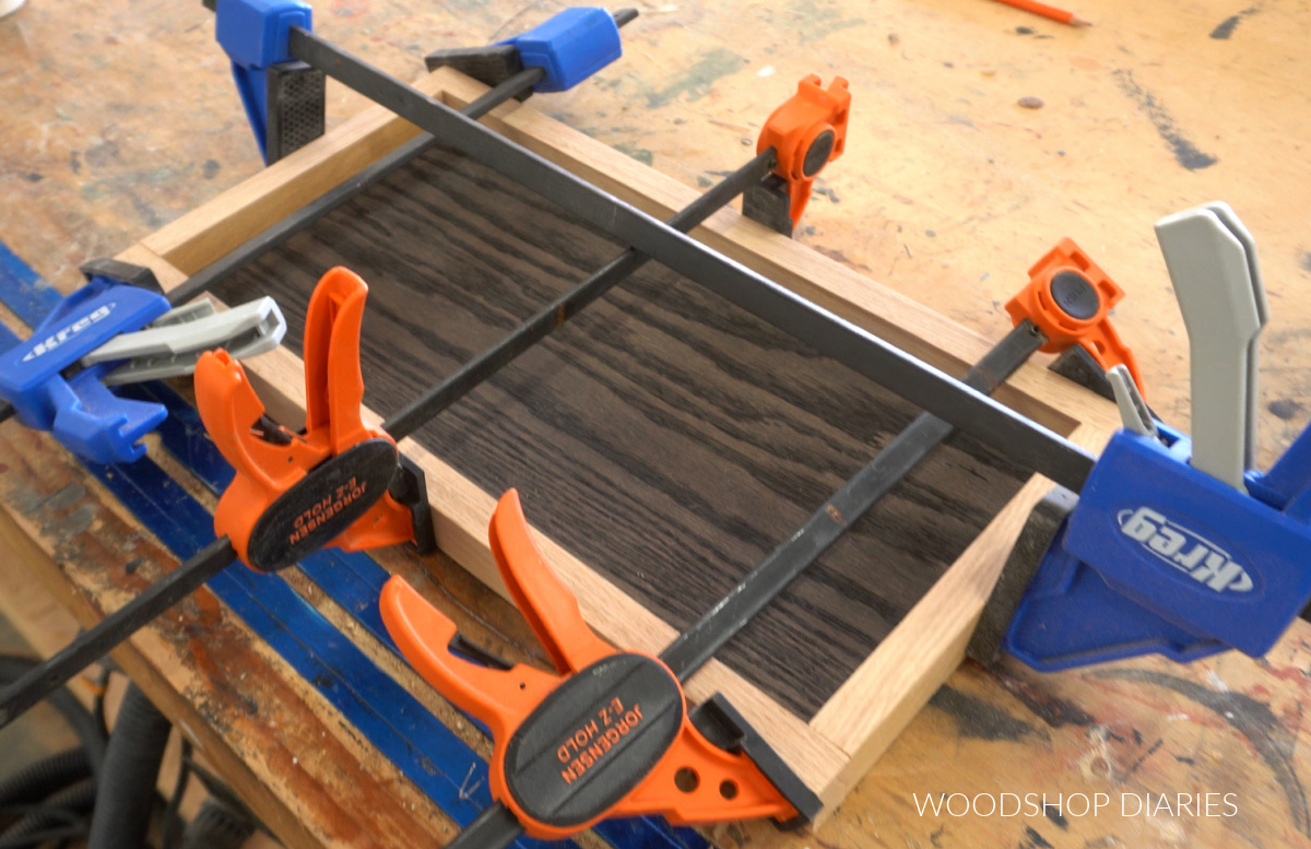 1x2s glued and clamped around organizer tray bottom