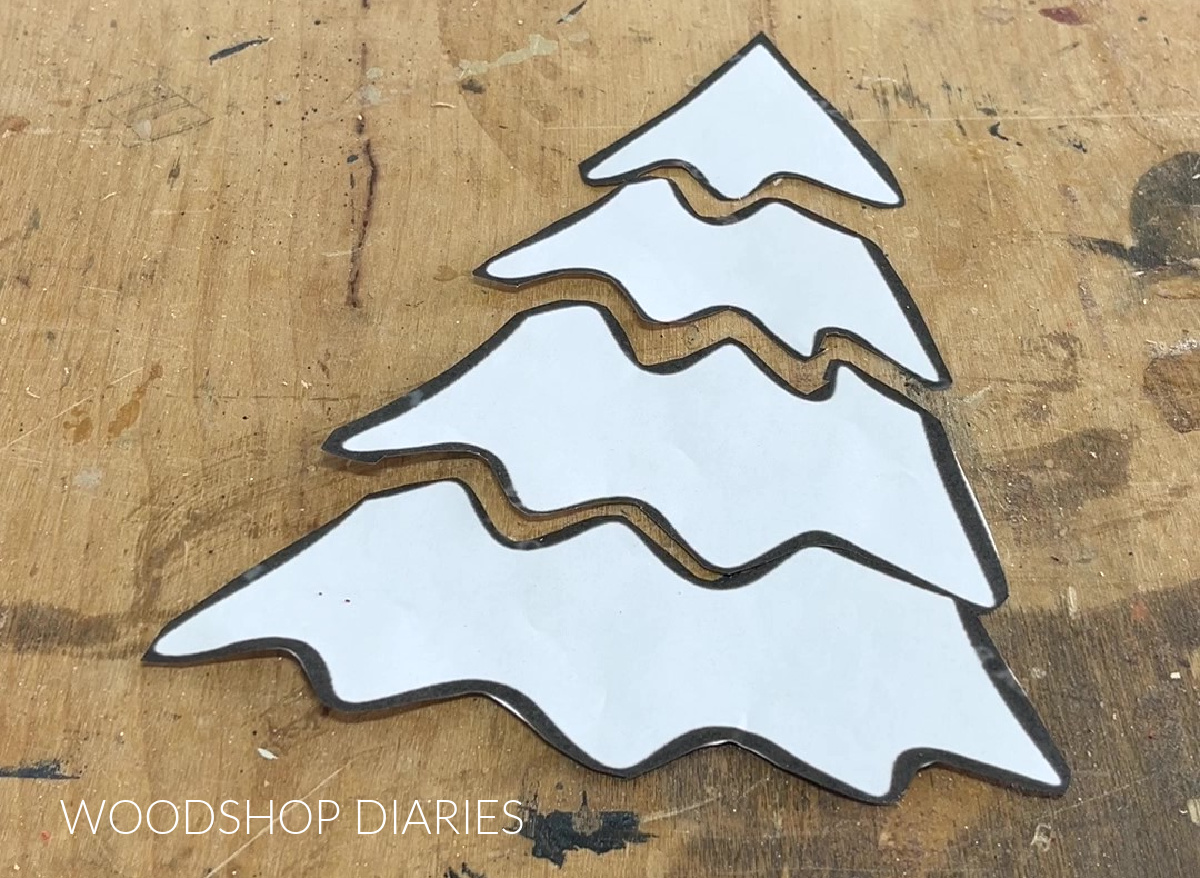 Christmas tree template shape cut into pieces on workbench