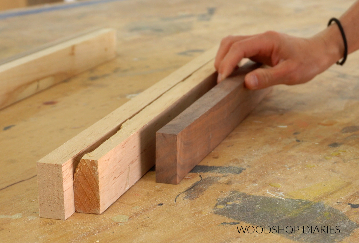 walnut and maple 1x2 lumber laying out on workbench