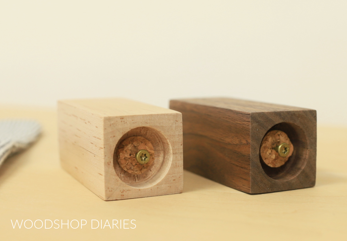 Corks plugging bottom of finished wooden DIY salt and pepper shakers