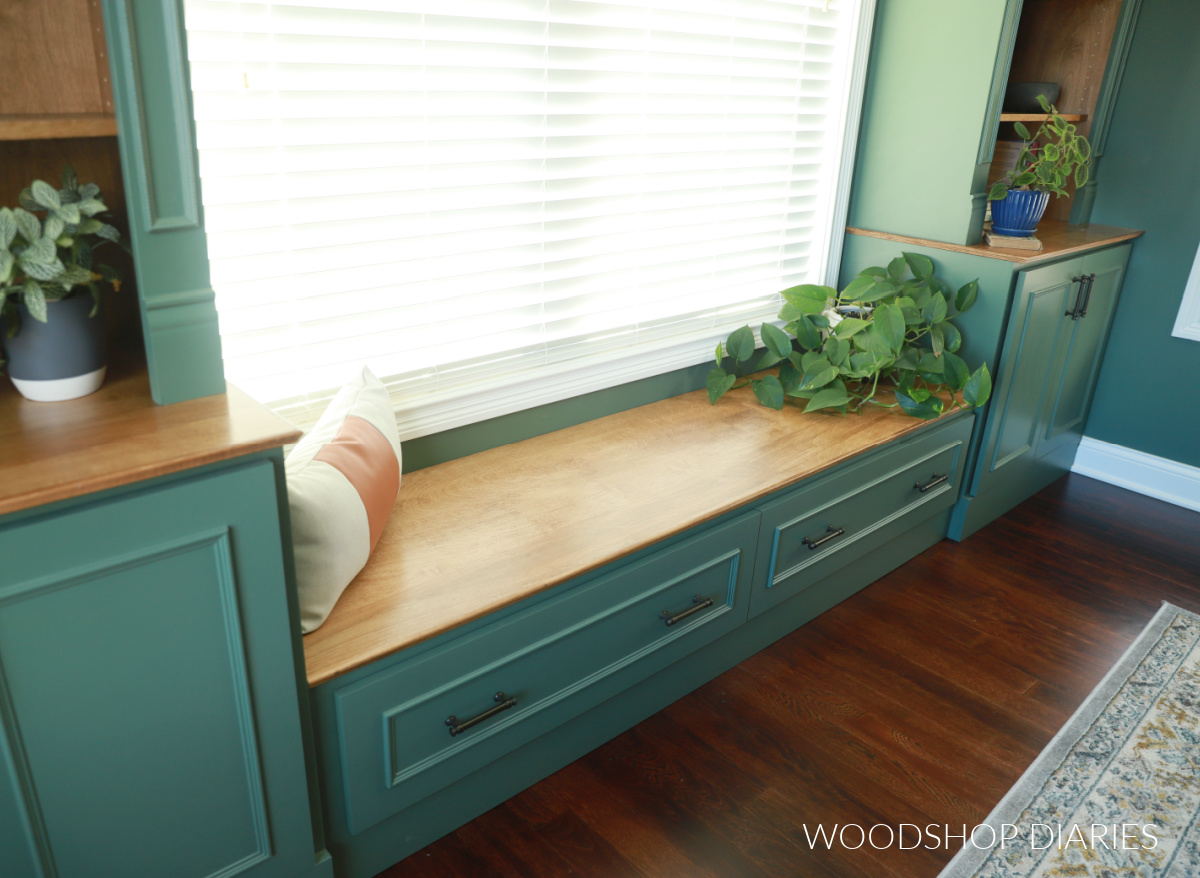 Close up of built in bench seat between two built in base cabinets in office
