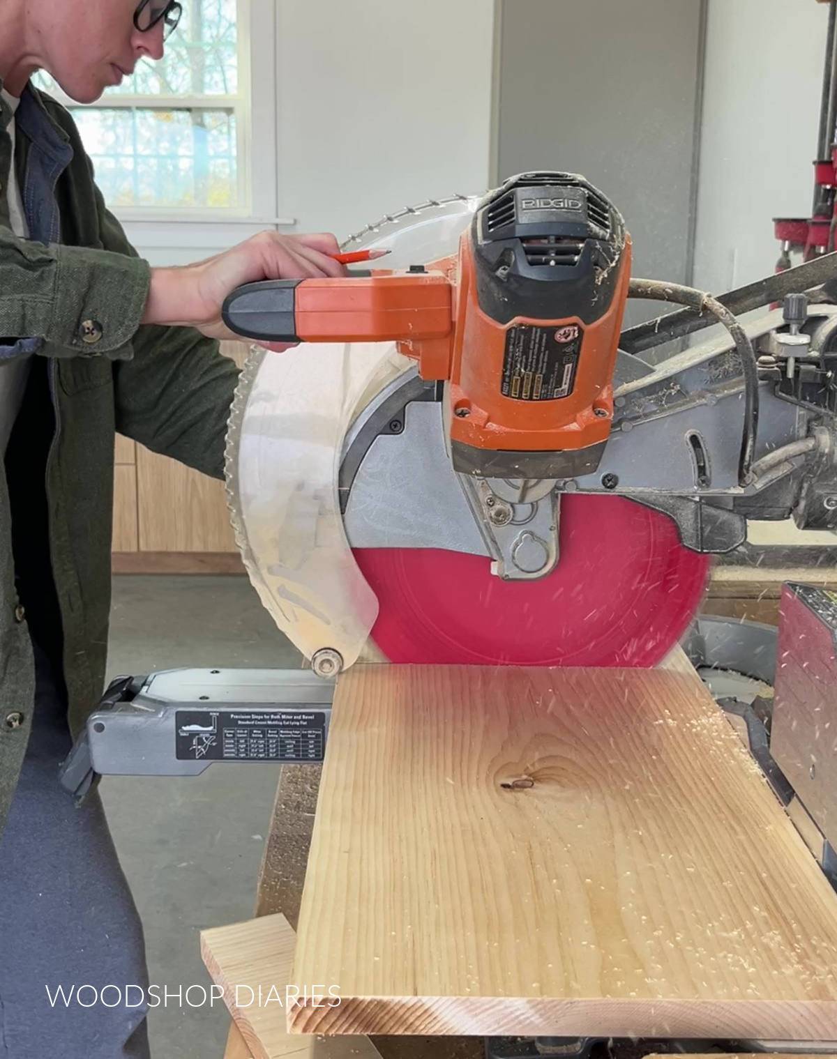 Shara Woodshop Diaries cutting 1x12 board on miter saw